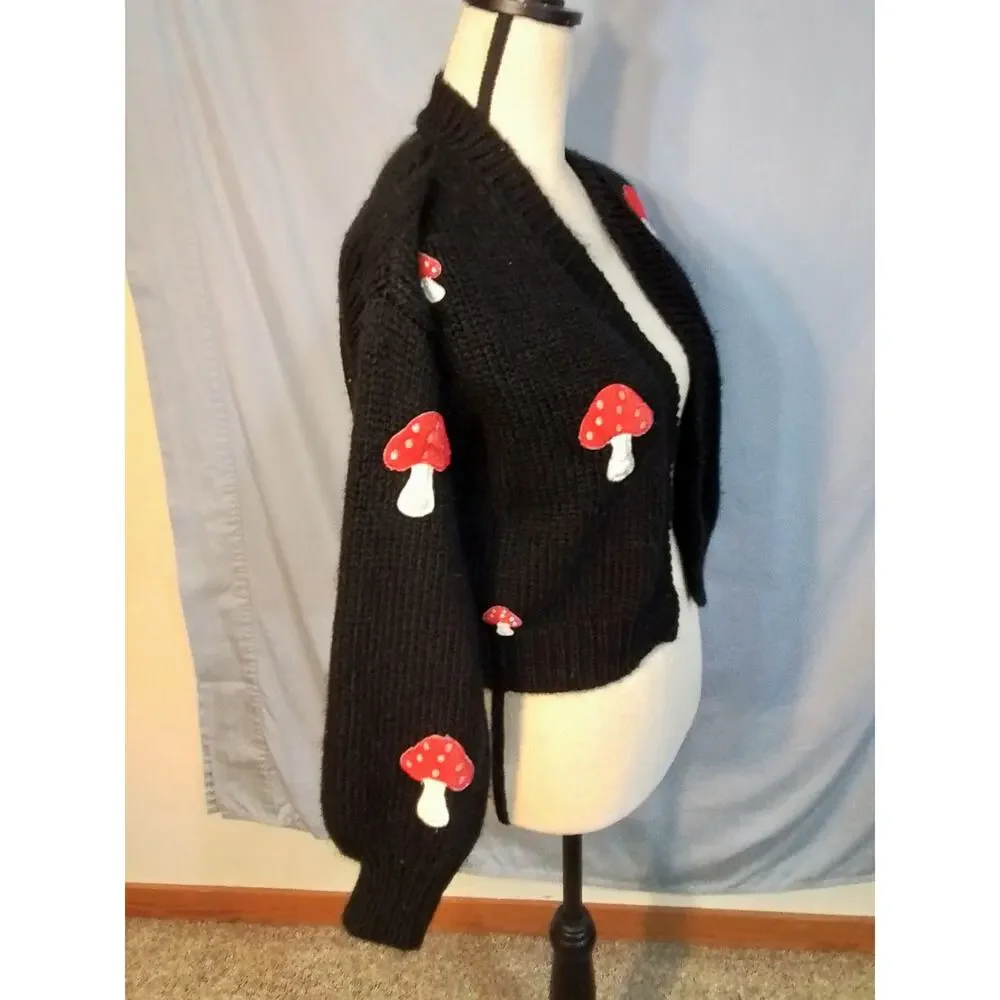 Forever 21 black sweater with red mushrooms.